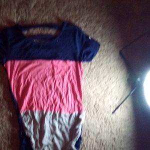 A multi coloured T-shirt with a back cut out.